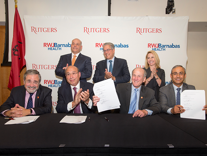 President Barchi, seated with (L-R) RBHS Chancellor Brian Strom, RWJBarnabas Health President and CEO Barry Ostrowsky, and Rutgers Health Group President and CEO Vicente Gracias